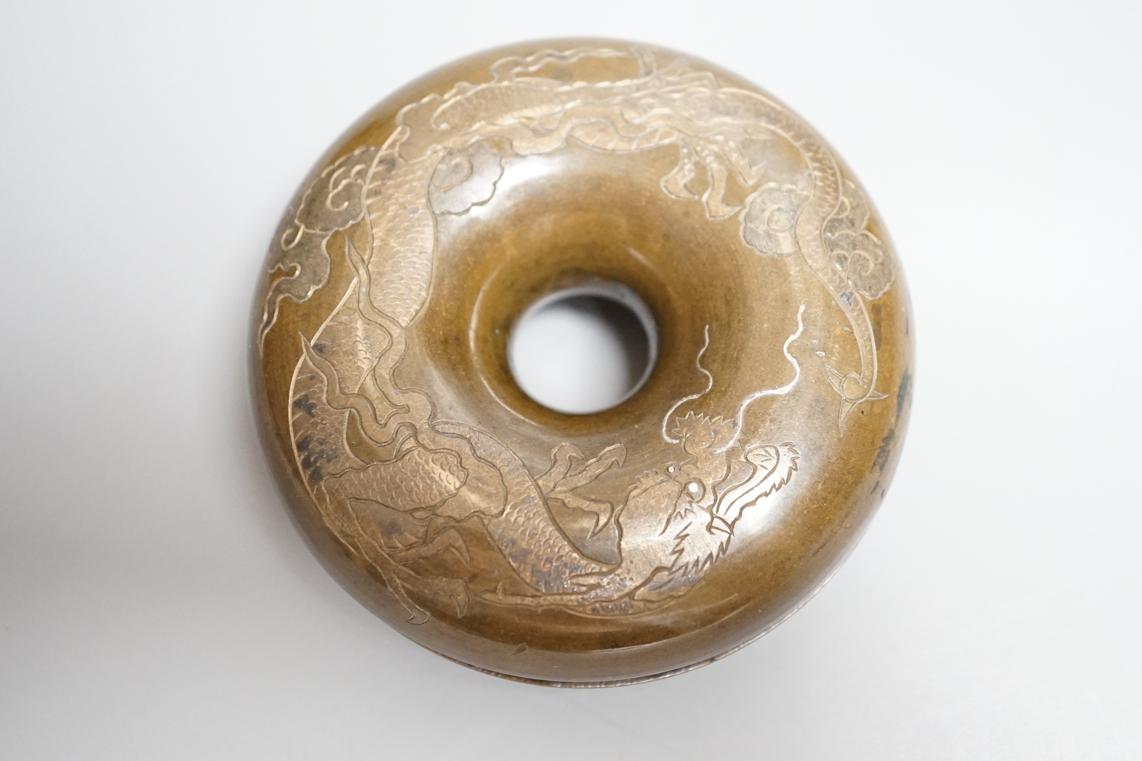 A Japanese silver inlaid bronze horse bell, Meiji period, diameter 9cm